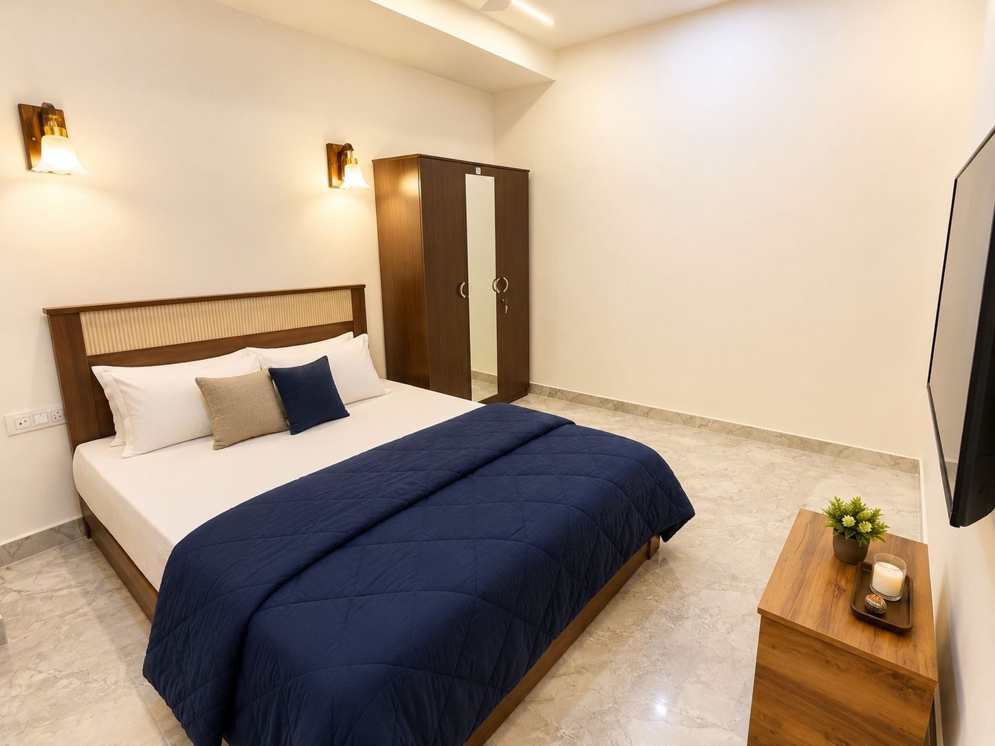 Cozy bedroom with seating at Ibiza Homestay Guwahati