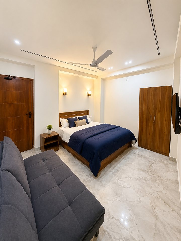 Bedroom with seating at Ibiza Homestay Guwahati